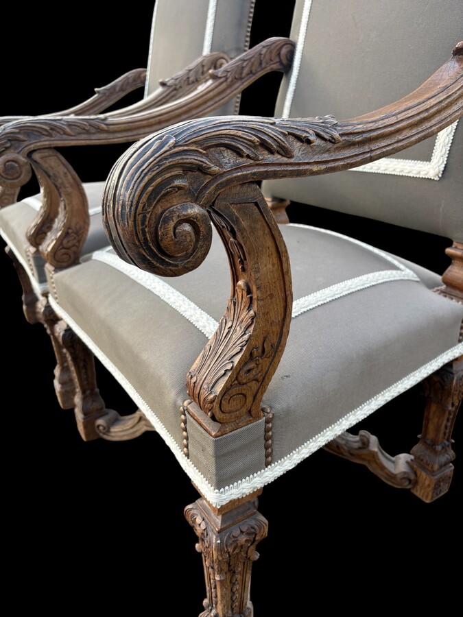 A pair of large 19th-century Regency-style oak armchairs. Decorative oak armchairs, upholstered in taupe fabric with a lace ribbon border. Dimensions: Height: 121 cm Width: 67 cm Depth: 70 cm