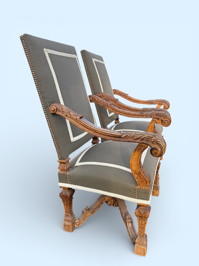 A pair of large 19th-century Regency-style oak armchairs. Decorative oak armchairs, upholstered in taupe fabric with a lace ribbon border. Dimensions: Height: 121 cm Width: 67 cm Depth: 70 cm