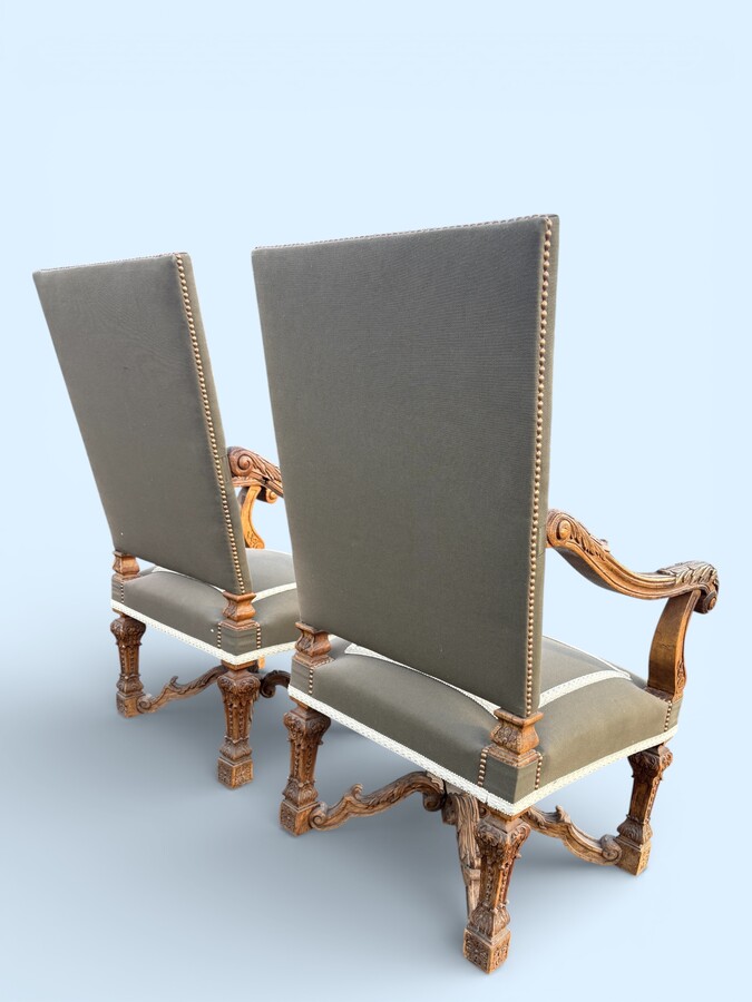 A pair of large 19th-century Regency-style oak armchairs. Decorative oak armchairs, upholstered in taupe fabric with a lace ribbon border. Dimensions: Height: 121 cm Width: 67 cm Depth: 70 cm