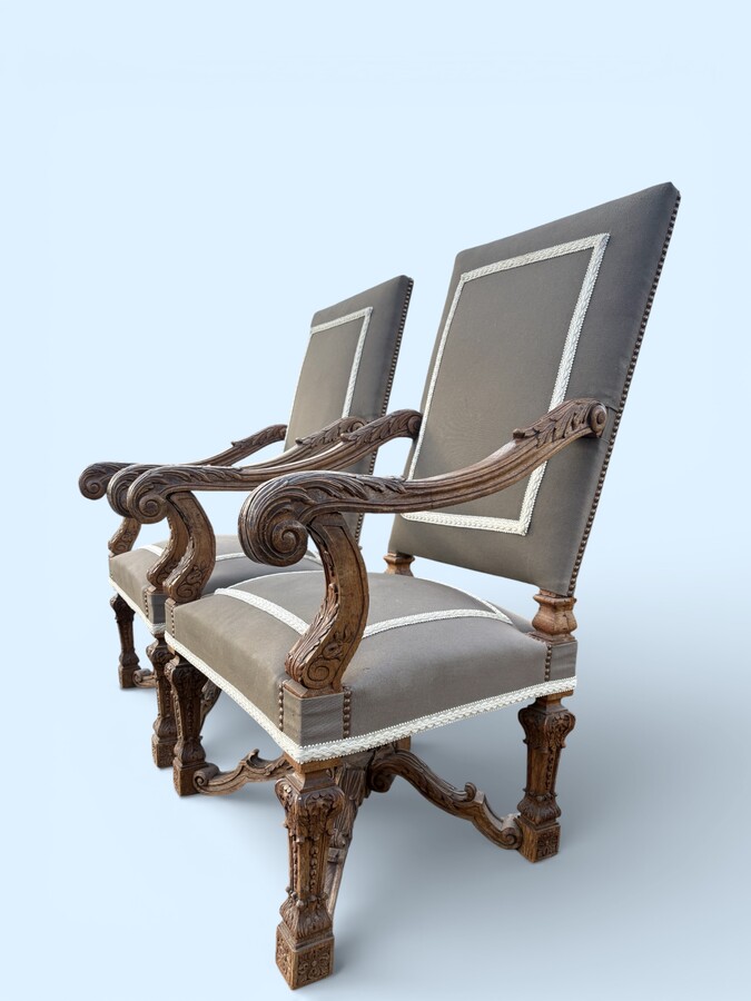 A pair of large 19th-century Regency-style oak armchairs. Decorative oak armchairs, upholstered in taupe fabric with a lace ribbon border. Dimensions: Height: 121 cm Width: 67 cm Depth: 70 cm