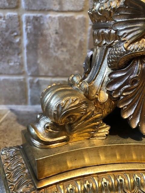 A pair of large gilded bronze candlesticks/lamp bases Charles X , some fish tails(3) are missing. Dimensions : 54 cm high and 23 cm wide.