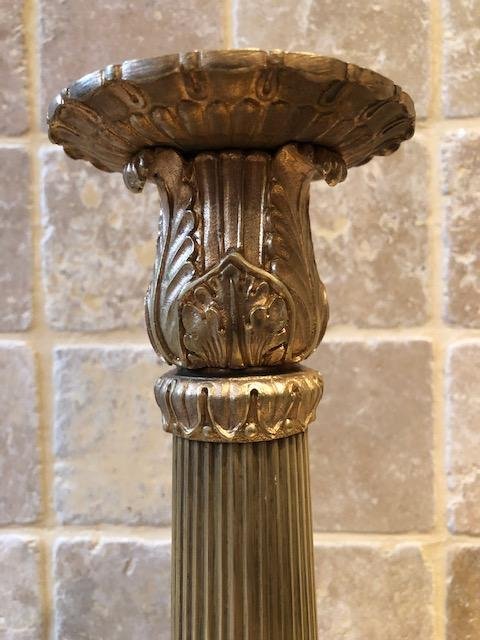 A pair of large gilded bronze candlesticks/lamp bases Charles X , some fish tails(3) are missing. Dimensions : 54 cm high and 23 cm wide.