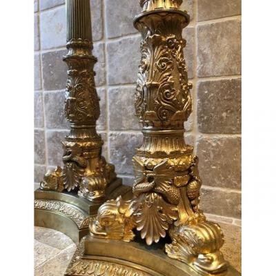 A pair of large gilded bronze candlesticks/lamp bases Charles X , some fish tails(3) are missing. Dimensions : 54 cm high and 23 cm wide.