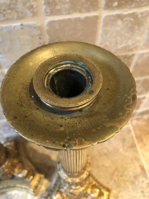 A pair of large gilded bronze candlesticks/lamp bases Charles X , some fish tails(3) are missing. Dimensions : 54 cm high and 23 cm wide.