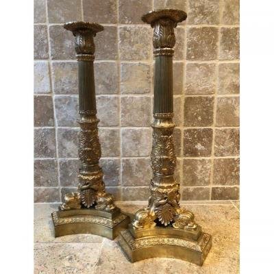 A pair of large gilded bronze candlesticks/lamp bases Charles X , some fish tails(3) are missing. Dimensions : 54 cm high and 23 cm wide.