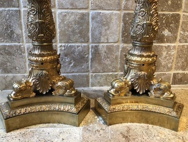 A pair of large gilded bronze candlesticks/lamp bases Charles X , some fish tails(3) are missing. Dimensions : 54 cm high and 23 cm wide.