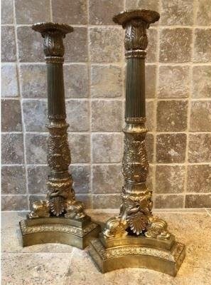 A pair of large gilded bronze candlesticks/lamp bases Charles X , some fish tails(3) are missing. Dimensions : 54 cm high and 23 cm wide.