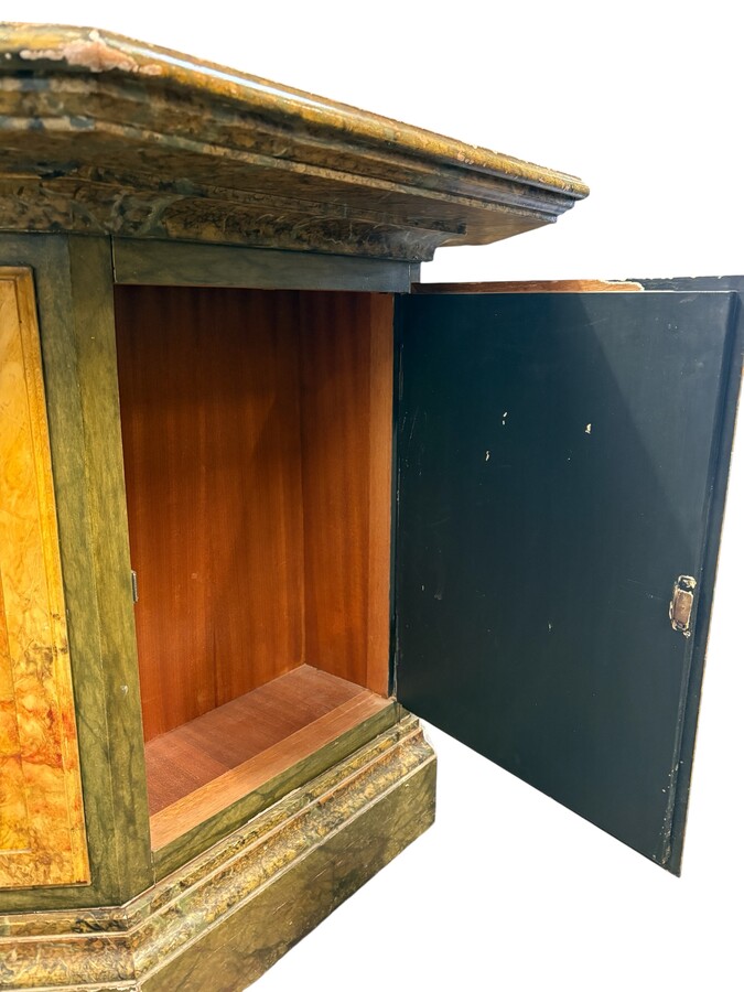 A special table painted to resemble marble 20th century. A decorative piece that can be used as a table, a pedestal or a piece of furniture. It features a triangular wooden top resting on a wooden base fitted with four panelled doors