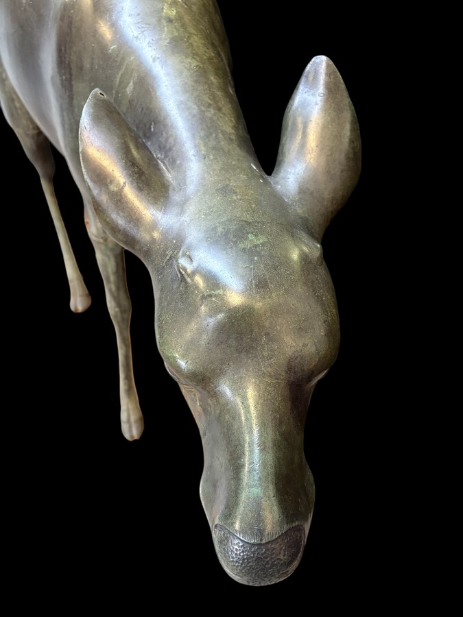  A superb 19thC. pair of life-size bronze sculptures depicting a doe and a stag, exquisitely detailed and featuring a magnificent antique patina. The deer show signs of wear and have undergone some previous restoration