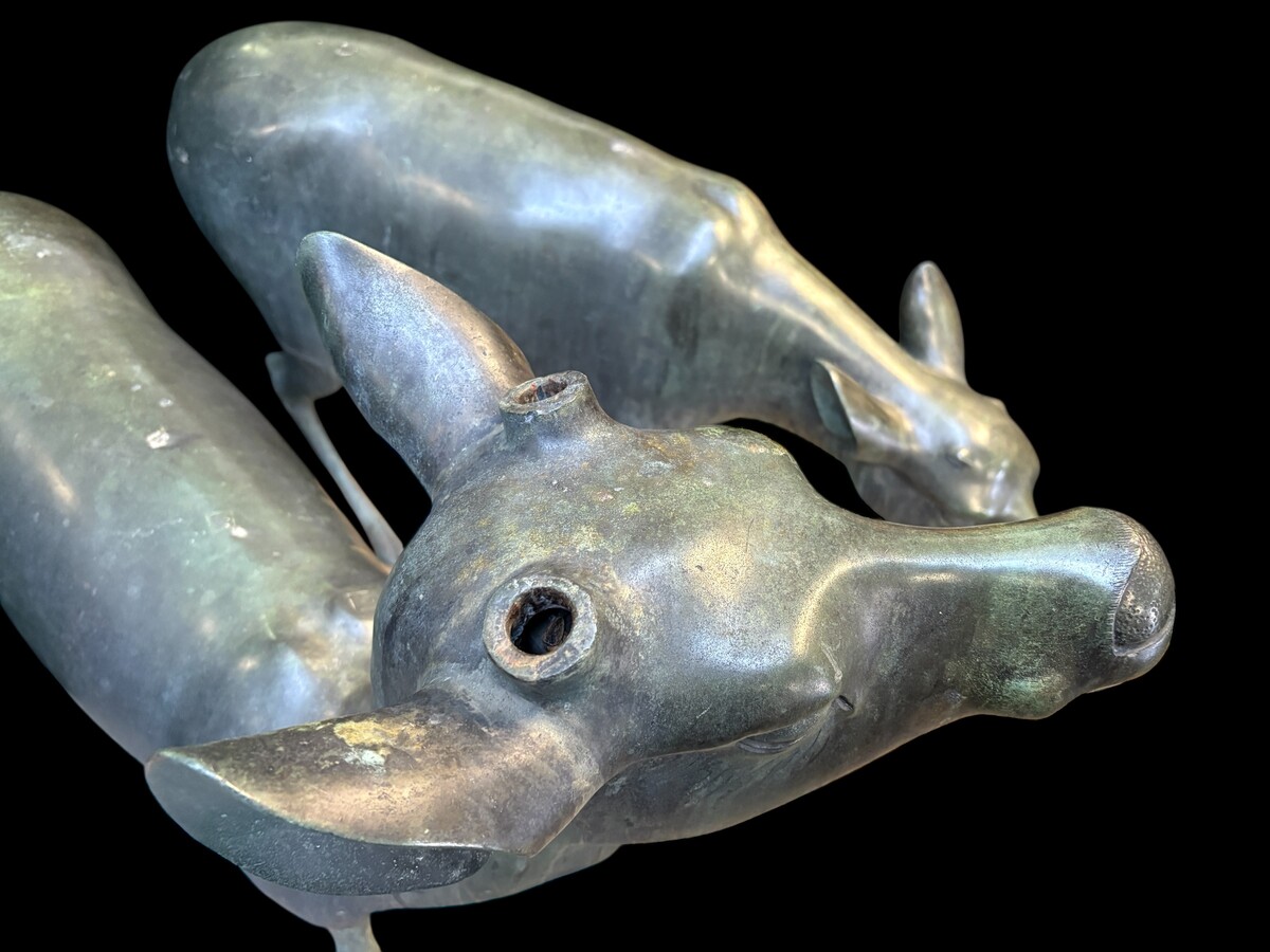  A superb 19thC. pair of life-size bronze sculptures depicting a doe and a stag, exquisitely detailed and featuring a magnificent antique patina. The deer show signs of wear and have undergone some previous restoration