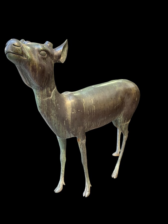  A superb 19thC. pair of life-size bronze sculptures depicting a doe and a stag, exquisitely detailed and featuring a magnificent antique patina. The deer show signs of wear and have undergone some previous restoration