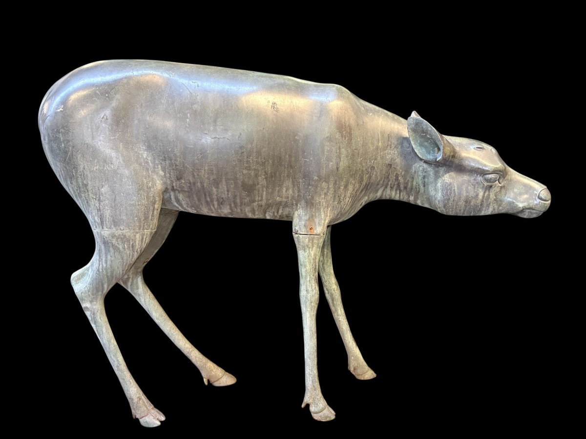 A superb 19thC. pair of life-size bronze sculptures depicting a doe and a stag, exquisitely detailed and featuring a magnificent antique patina. The deer show signs of wear and have undergone some previous restoration