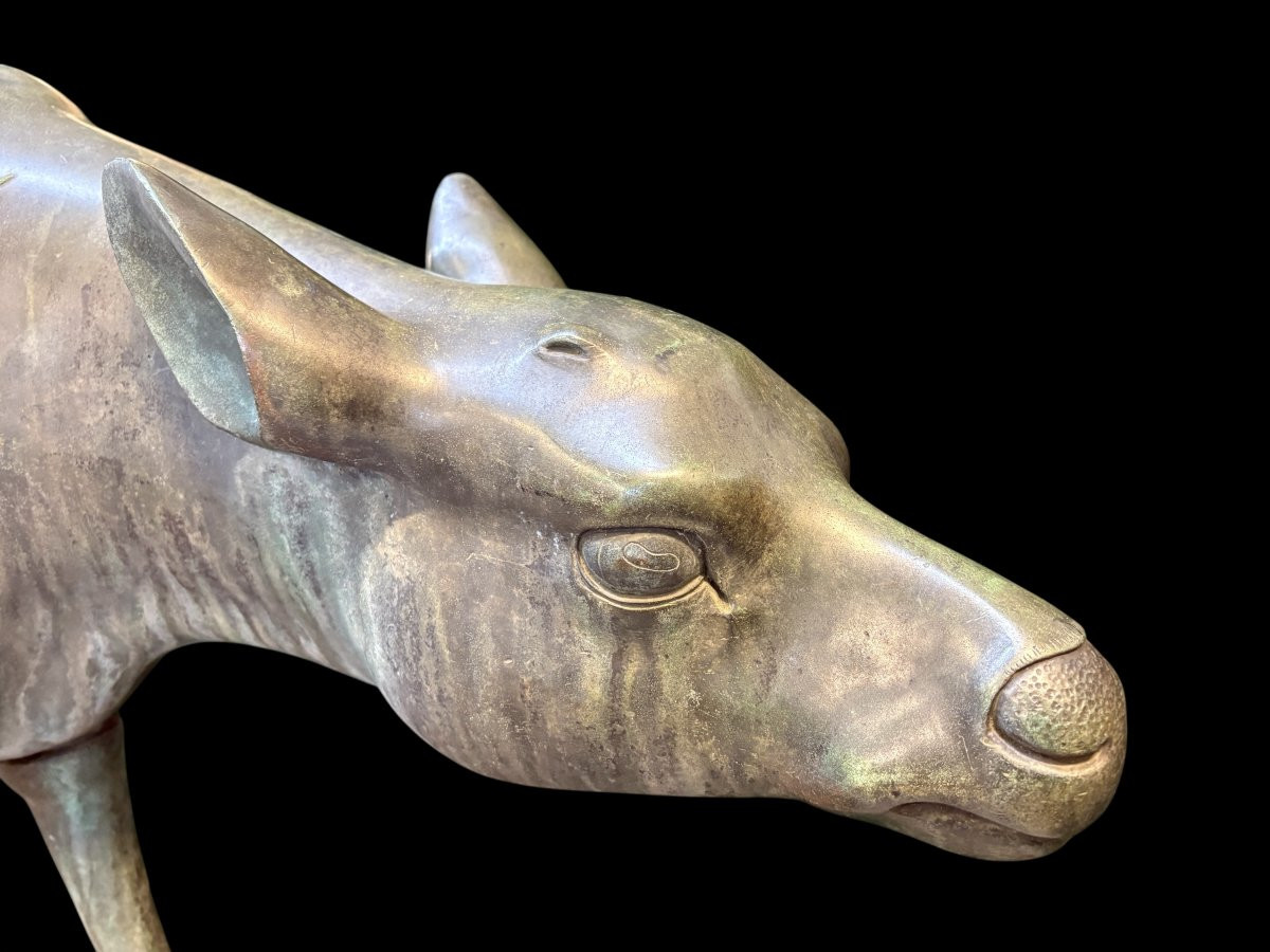 A superb 19thC. pair of life-size bronze sculptures depicting a doe and a stag, exquisitely detailed and featuring a magnificent antique patina. The deer show signs of wear and have undergone some previous restoration