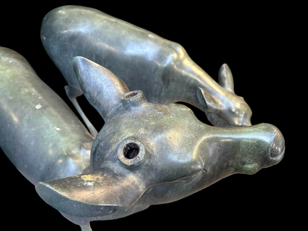 A superb 19thC. pair of life-size bronze sculptures depicting a doe and a stag, exquisitely detailed and featuring a magnificent antique patina. The deer show signs of wear and have undergone some previous restoration