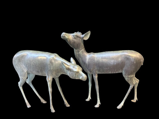 A superb 19thC. pair of life-size bronze sculptures depicting a doe and a stag, exquisitely detailed and featuring a magnificent antique patina. The deer show signs of wear and have undergone some previous restoration
