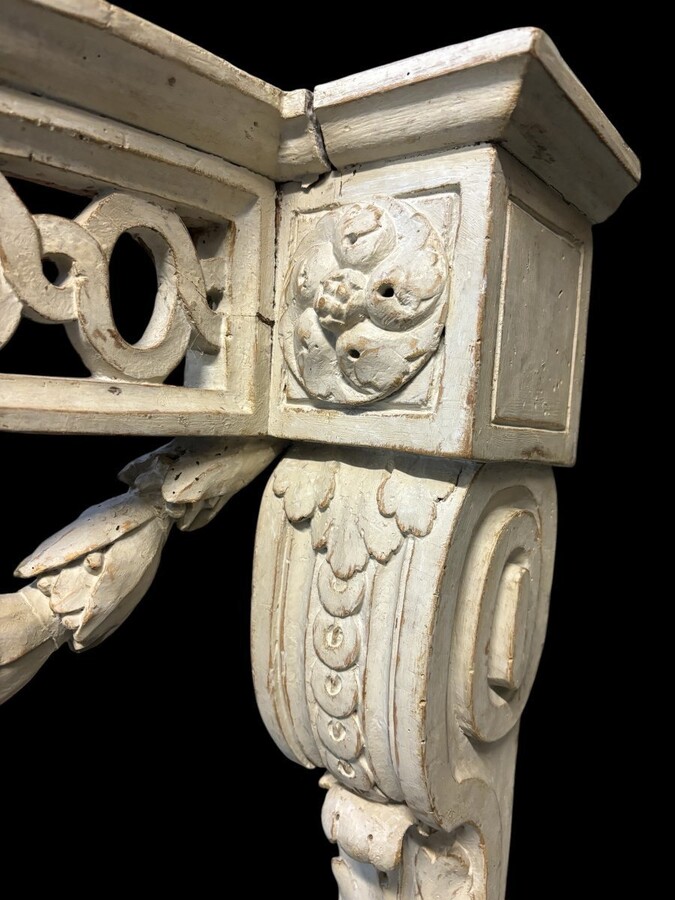Beautiful Louis XVI style wall console in 18th century painted wood. Very decorative curved console in the Louis XVI style, decorated with girlandes with its original white marble. Dimensions : Height : 62 cm Width : 94,5 cm Depth : 51 cm