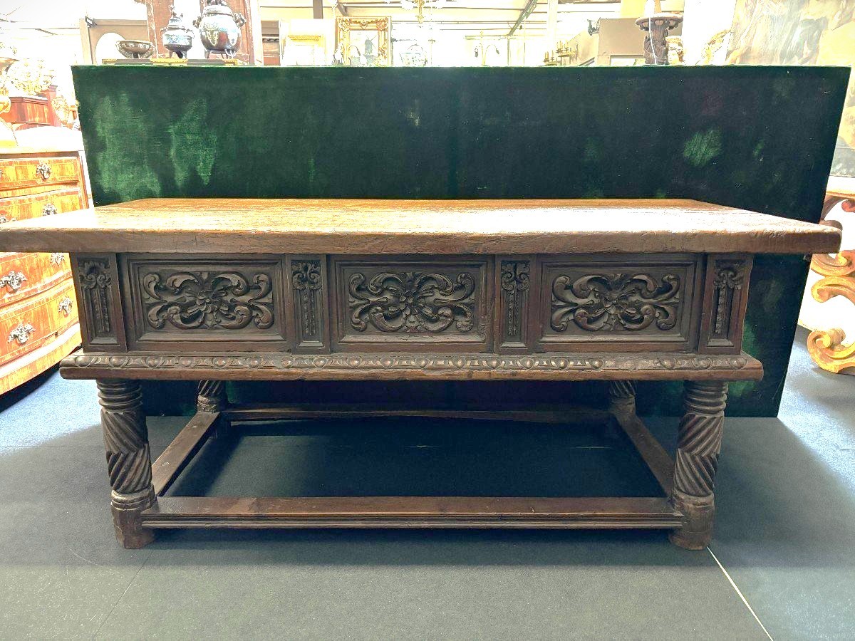 Beautiful Spanish table in Chestnut wood 17th century. Large sturdy table finished on 4 sides with beautiful wood carved decorations and fitted with 3 large drawers at the front. Beautiful thick top of 5 cm. Table in good condition