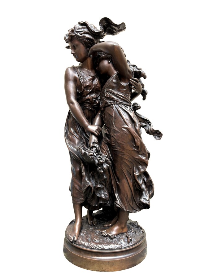 bronze sculpture depicting a young woman with a little girl carrying a basket of flowers. Very finely detailed, signed by Hippolyte Moreau and has a beautiful brown patina. François-Hippolyte Moreau (Dijon 1832–Neuilly-sur-Seine 1926) 