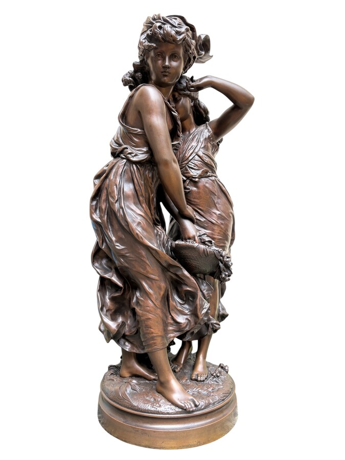 bronze sculpture depicting a young woman with a little girl carrying a basket of flowers. Very finely detailed, signed by Hippolyte Moreau and has a beautiful brown patina. François-Hippolyte Moreau (Dijon 1832–Neuilly-sur-Seine 1926) 