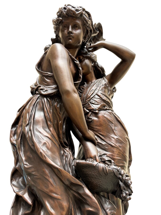 bronze sculpture depicting a young woman with a little girl carrying a basket of flowers. Very finely detailed, signed by Hippolyte Moreau and has a beautiful brown patina. François-Hippolyte Moreau (Dijon 1832–Neuilly-sur-Seine 1926) 