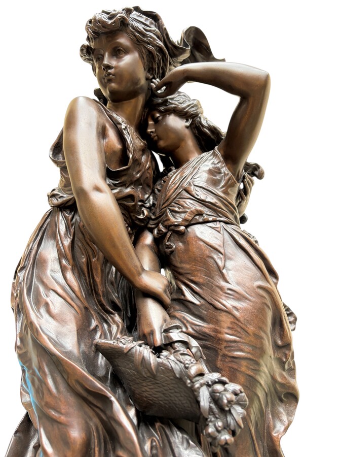 bronze sculpture depicting a young woman with a little girl carrying a basket of flowers. Very finely detailed, signed by Hippolyte Moreau and has a beautiful brown patina. François-Hippolyte Moreau (Dijon 1832–Neuilly-sur-Seine 1926) 