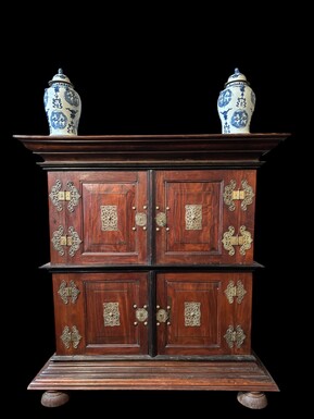 Colonial 4-door cabinet with 18th century bronze fittings Special piece of furniture from the Dutch Indies in tropical wood and ebony with 4 doors and beautiful bronze fittings. It stands on large carved feet. The cabinet can be dismantled.
