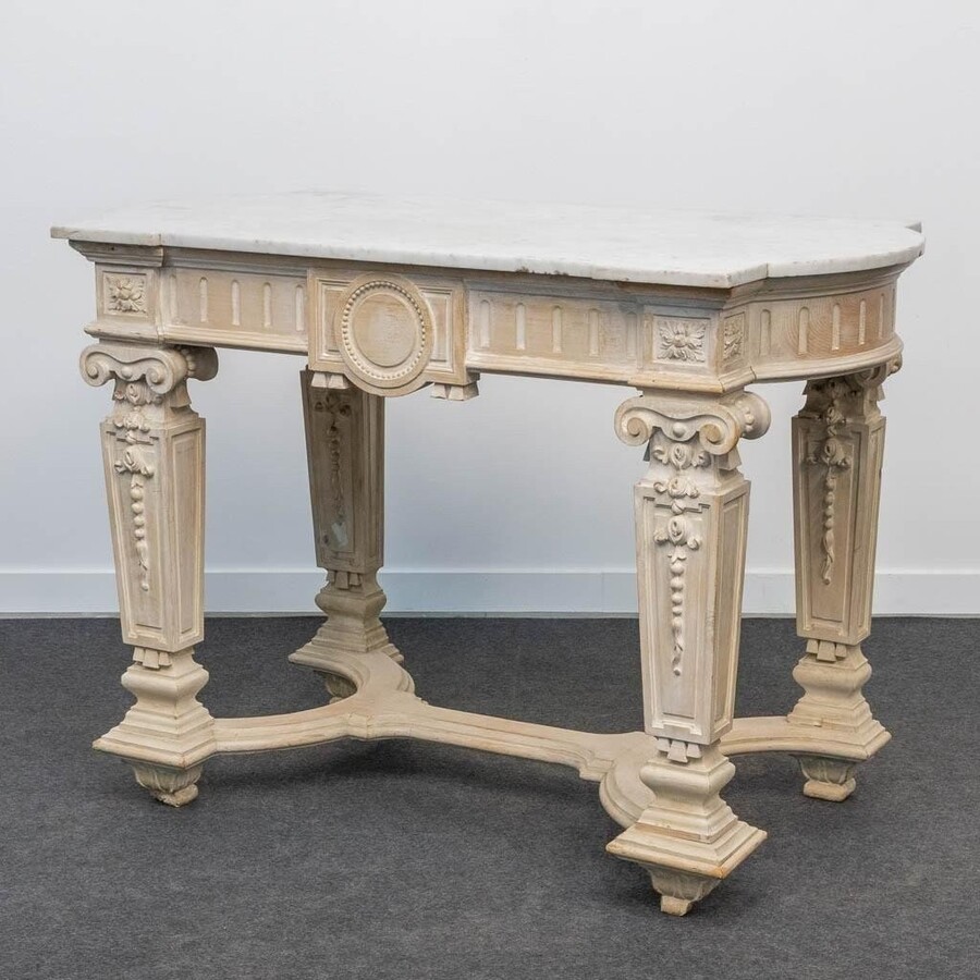 Decorative console of sculpted wood Louis XVI style late 19th century. Model with iconic columns minor damages and crack in marble top. Dimensions : Width: 125 cm Height: 87 cm Depth: 65,5 cm