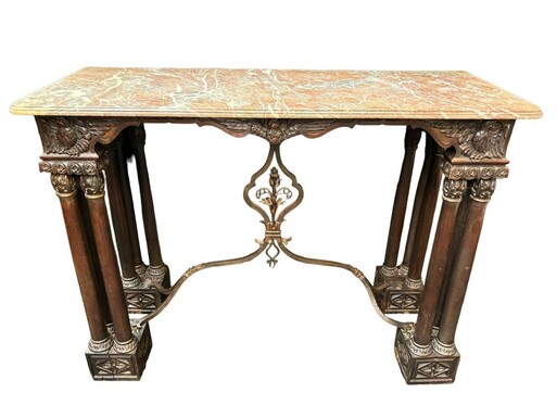 Decorative console/wall table in walnut 19thC. Special console with eagle sculptures in front and on both sides and fitted with 3 columns per leg. The 4 legs are connected with a wrought-iron decoration , the top is in marble Dimensions : Width : 131 cm