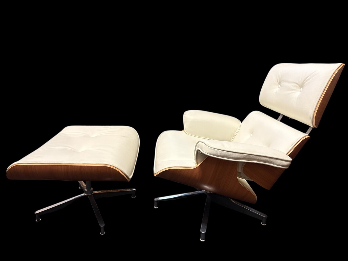 Eames Lounge Chair with Ottoman footrest - in white leather with 21st century ash wood frame. Very elegant lounge chair in excellent condition. Lounge chair based on Eames design. Chair dimensions: Height: 86 cm Width: 89 cm Depth: 80 cm Footstool: 43 x 6