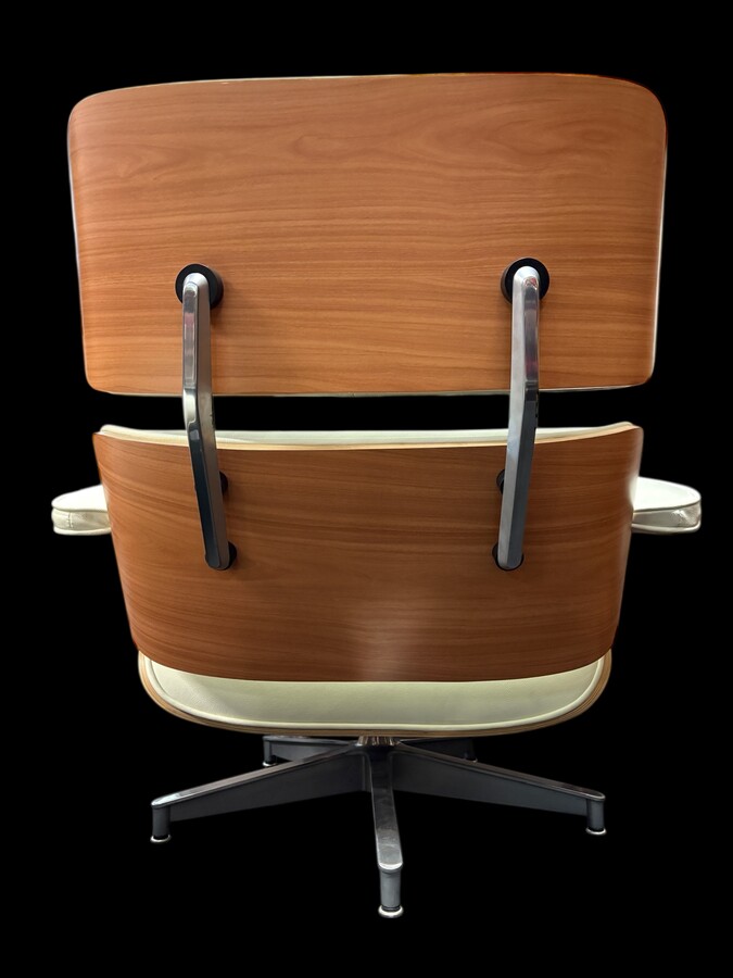 Eames Lounge Chair with Ottoman footrest - in white leather with 21st century ash wood frame. Very elegant lounge chair in excellent condition. Lounge chair based on Eames design. Chair dimensions: Height: 86 cm Width: 89 cm Depth: 80 cm Footstool: 43 x 6