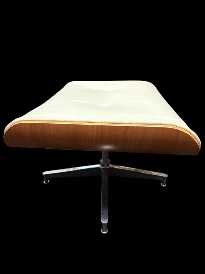 Eames Lounge Chair with Ottoman footrest - in white leather with 21st century ash wood frame. Very elegant lounge chair in excellent condition. Lounge chair based on Eames design. Chair dimensions: Height: 86 cm Width: 89 cm Depth: 80 cm Footstool: 43 x 6