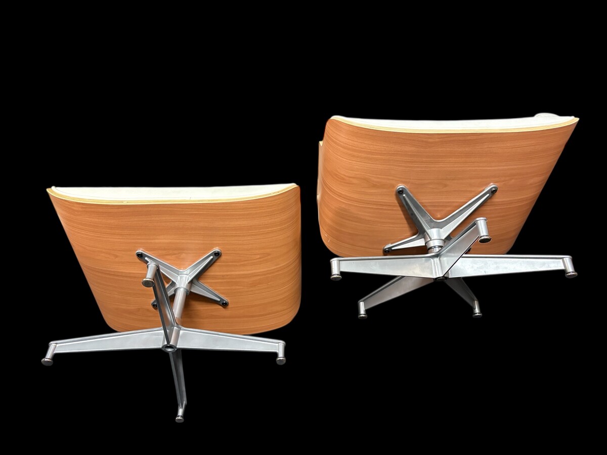 Eames Lounge Chair with Ottoman footrest - in white leather with 21st century ash wood frame. Very elegant lounge chair in excellent condition. Lounge chair based on Eames design. Chair dimensions: Height: 86 cm Width: 89 cm Depth: 80 cm Footstool: 43 x 6