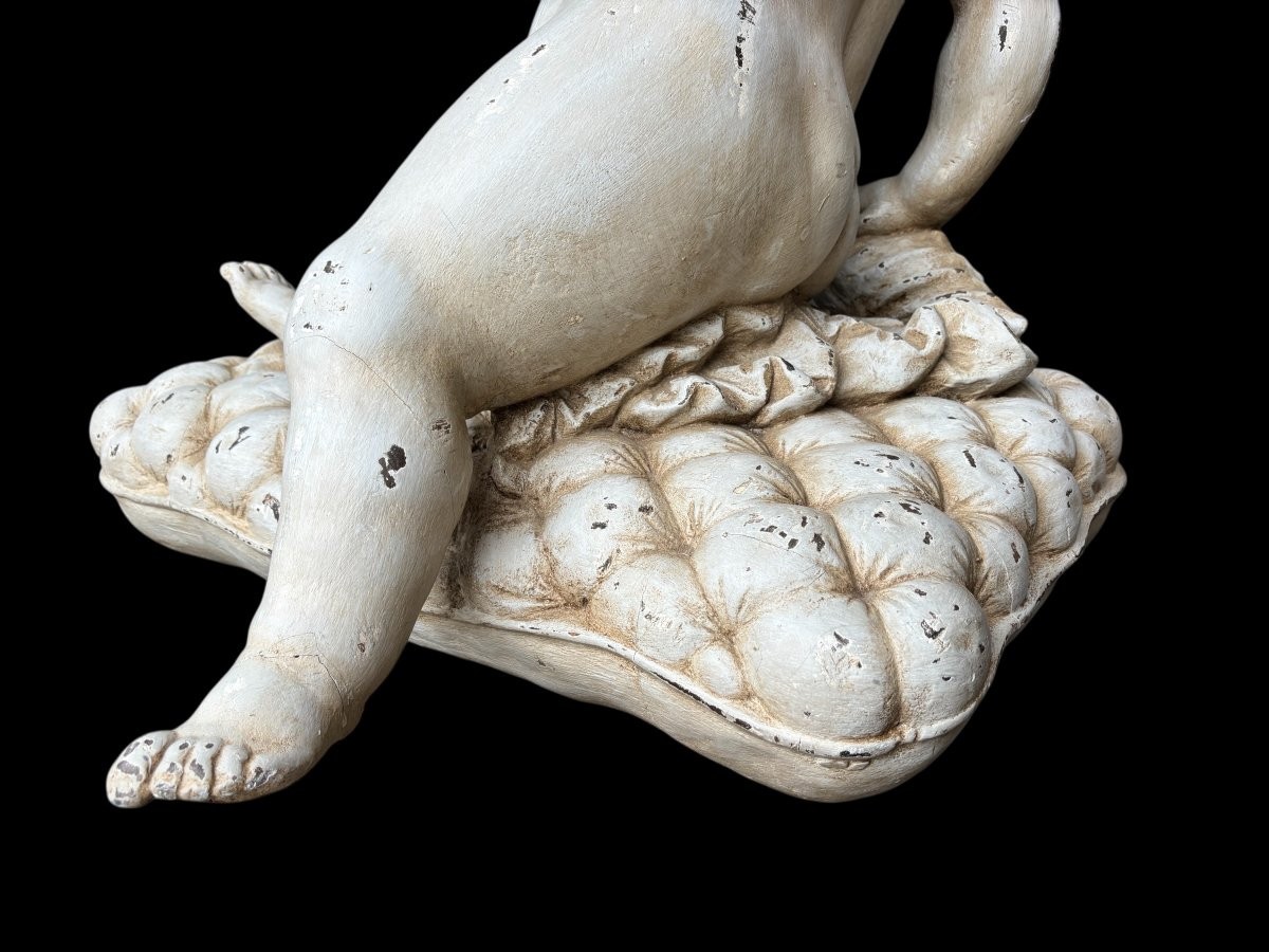 Large 18thC. painted wood sculpture of a putti. ( 92 cm ) Very decorative wooden sculpture representing a large putti with a shell in his hand, sitting on a cushion. The sculpture can be used as a table or pedestal if a glass or marble top is used.