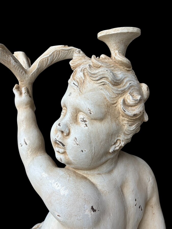 Large 18thC. painted wood sculpture of a putti. ( 92 cm ) Very decorative wooden sculpture representing a large putti with a shell in his hand, sitting on a cushion. The sculpture can be used as a table or pedestal if a glass or marble top is used.