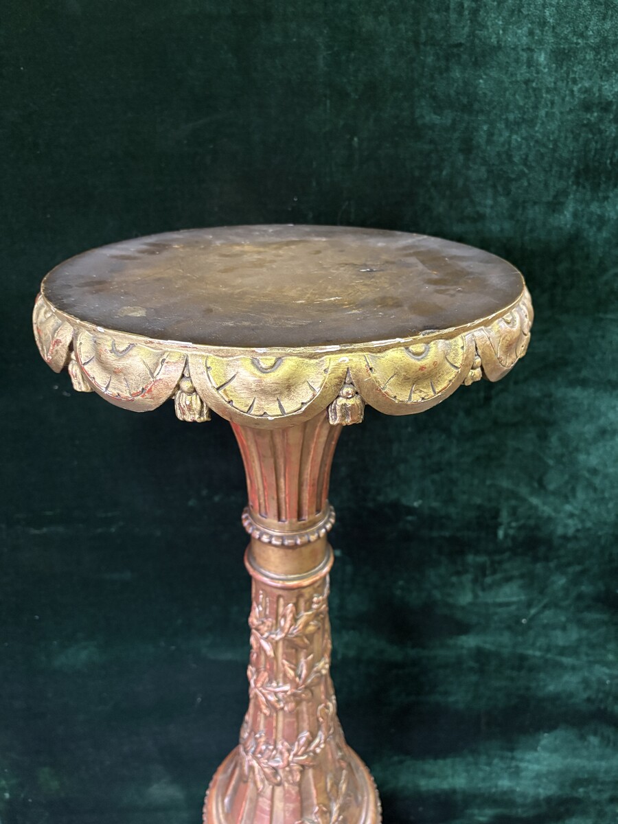 Large 19th-century gilded wooden candelabra (163 cm) Decorative candelabra with a stem, adorned with motifs, tendrils, garlands, French lilies, drapery and tassels, resting on three large legs decorated with mythological fish and scrolls.