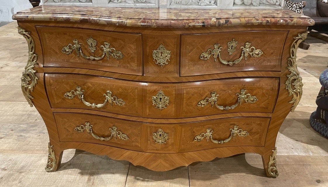 Large commode in Louis XV style 19thC. Dresser with parquet veneer, gilt bronze ornaments and fitted with 2 small drawers at the top and 2 large ones below. At the top a beautiful Plateau en Marbre Breche d'Alep. Dimensions : Width : 139 cm