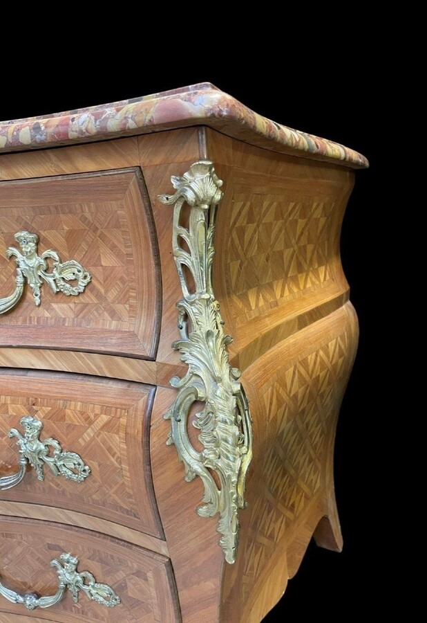 Large commode in Louis XV style 19thC. Dresser with parquet veneer, gilt bronze ornaments and fitted with 2 small drawers at the top and 2 large ones below. At the top a beautiful Plateau en Marbre Breche d'Alep. Dimensions : Width : 139 cm