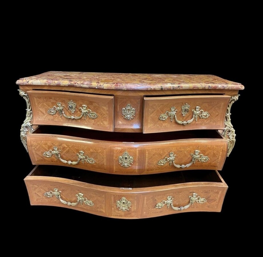 Large commode in Louis XV style 19thC. Dresser with parquet veneer, gilt bronze ornaments and fitted with 2 small drawers at the top and 2 large ones below. At the top a beautiful Plateau en Marbre Breche d'Alep. Dimensions : Width : 139 cm
