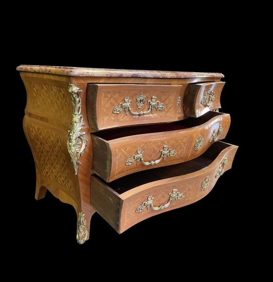 Large commode in Louis XV style 19thC. Dresser with parquet veneer, gilt bronze ornaments and fitted with 2 small drawers at the top and 2 large ones below. At the top a beautiful Plateau en Marbre Breche d'Alep. Dimensions : Width : 139 cm