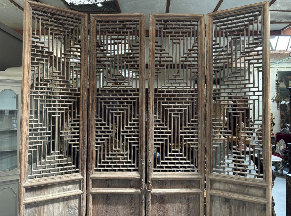 Large , decorative 4-piece door in solid wood 19thC. The doors have openwork panels at the top and closed panels at the bottom and have their original wrought iron fittings and a beautiful natural patina Dimensions : Height : 278 cm Total width : 240 cm