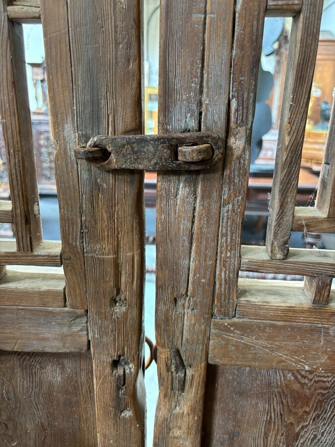Large , decorative 4-piece door in solid wood 19thC. The doors have openwork panels at the top and closed panels at the bottom and have their original wrought iron fittings and a beautiful natural patina Dimensions : Height : 278 cm Total width : 240 cm