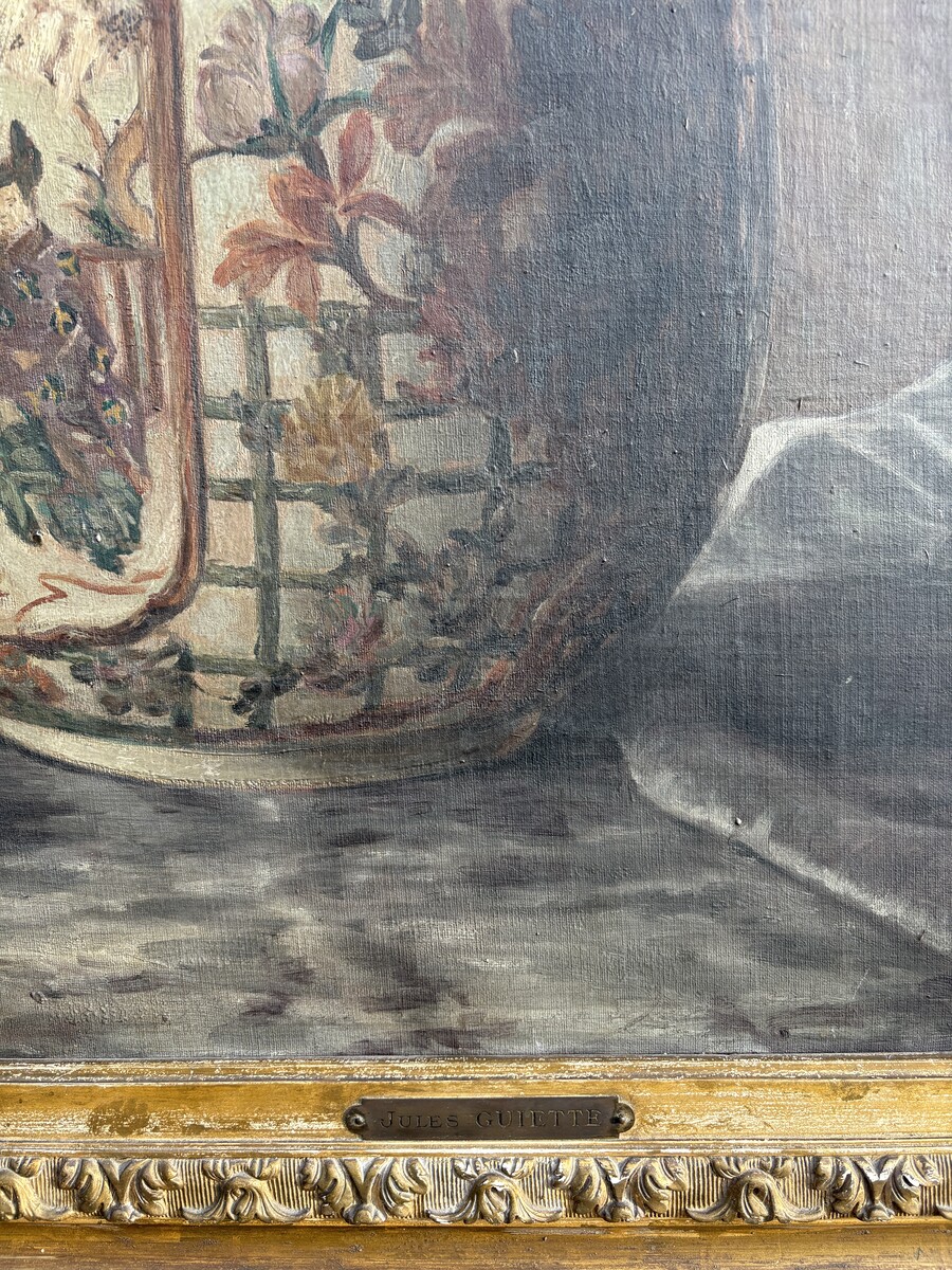 Large decorative oil painting on canvas, mounted on wood, depicting a large bouquet of flowers in a Japanese porcelain vase, with its magnificent original gilded frame. The work is signed lower left: Jules Guiette. (140 x 173.5 cm)