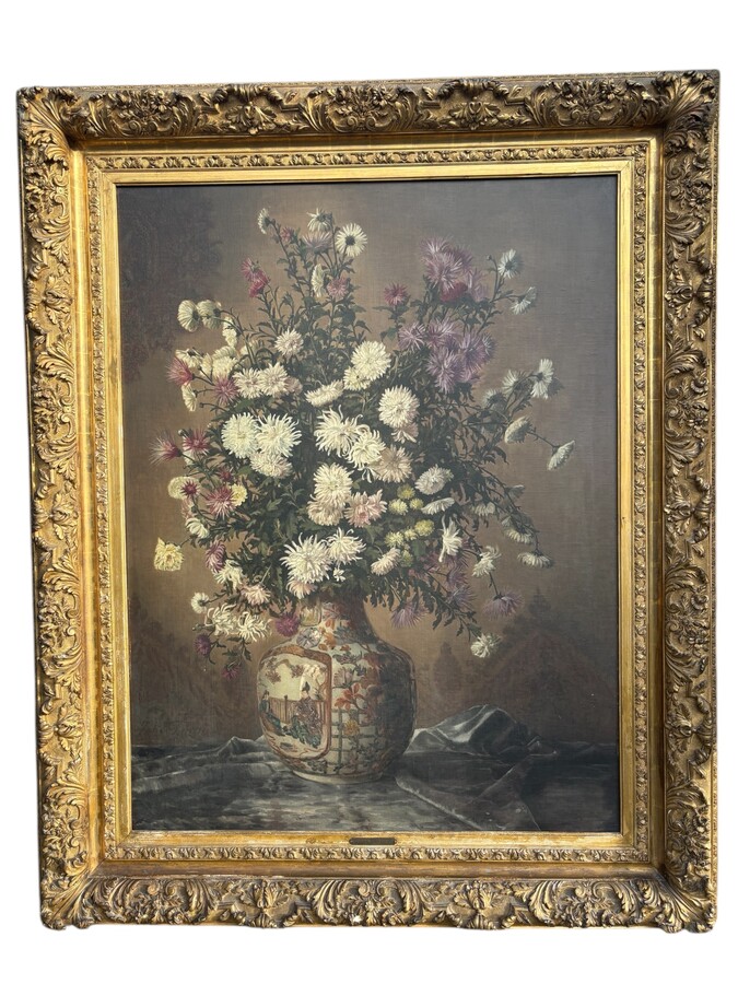 Large decorative oil painting on canvas, mounted on wood, depicting a large bouquet of flowers in a Japanese porcelain vase, with its magnificent original gilded frame. The work is signed lower left: Jules Guiette. (140 x 173.5 cm)