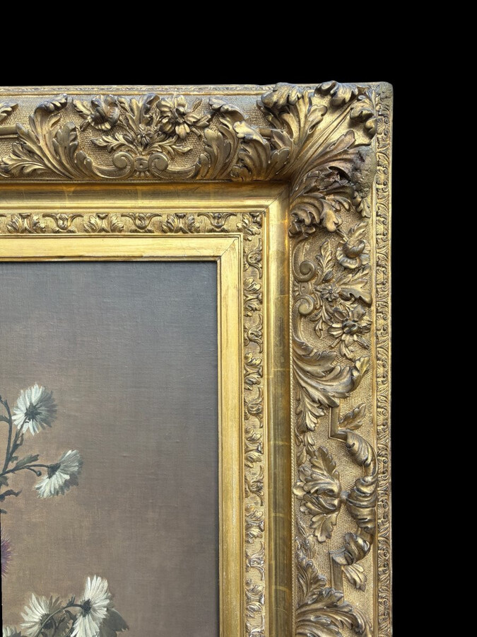 Large decorative oil painting on canvas, mounted on wood, depicting a large bouquet of flowers in a Japanese porcelain vase, with its magnificent original gilded frame. The work is signed lower left: Jules Guiette. (140 x 173.5 cm)