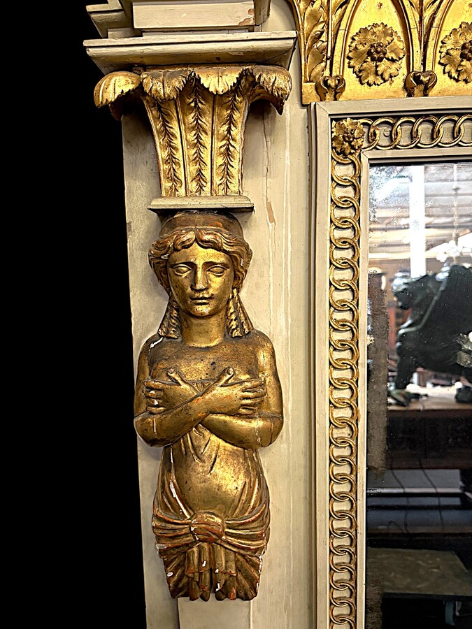 Large Empire console table with mirror, 1800–1820 (282.5 cm) Large console table with an original Empire-period mirror The console table and mirror are made of painted wood, adorned with caryatids, gilded woodwork and decorative elements.
