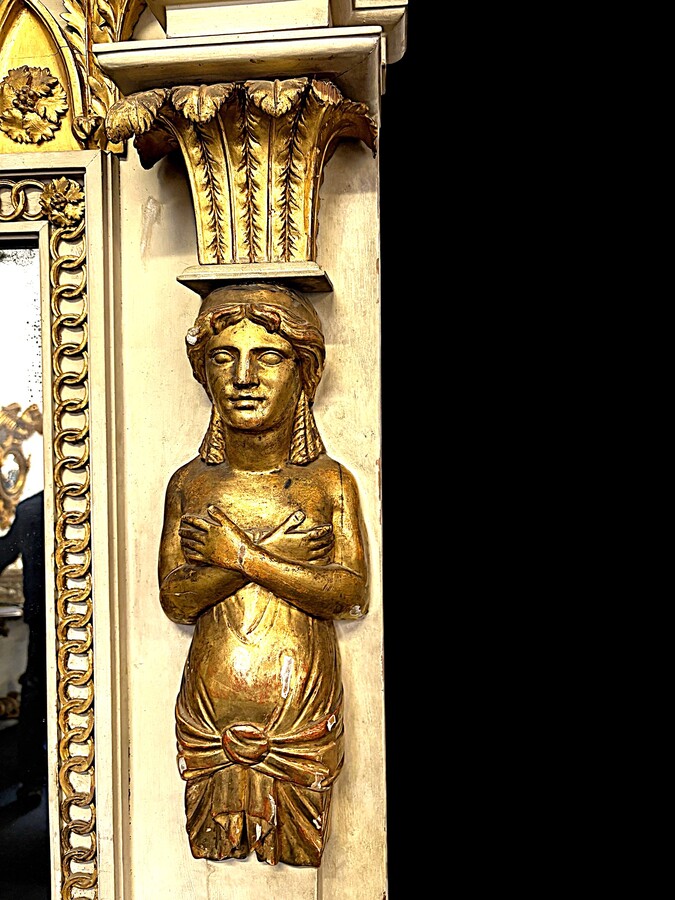 Large Empire console table with mirror, 1800–1820 (282.5 cm) Large console table with an original Empire-period mirror The console table and mirror are made of painted wood, adorned with caryatids, gilded woodwork and decorative elements.