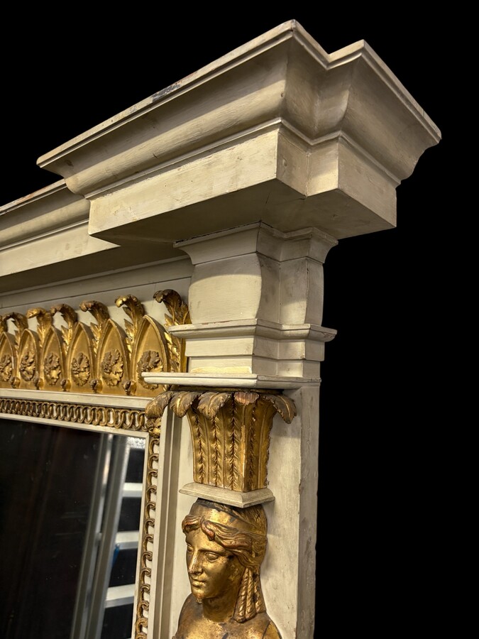 Large Empire console table with mirror, 1800–1820 (282.5 cm) Large console table with an original Empire-period mirror The console table and mirror are made of painted wood, adorned with caryatids, gilded woodwork and decorative elements.
