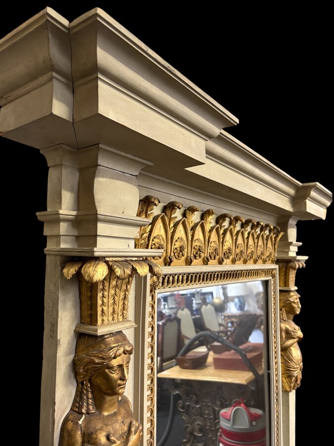 Large Empire console table with mirror, 1800–1820 (282.5 cm) Large console table with an original Empire-period mirror The console table and mirror are made of painted wood, adorned with caryatids, gilded woodwork and decorative elements.