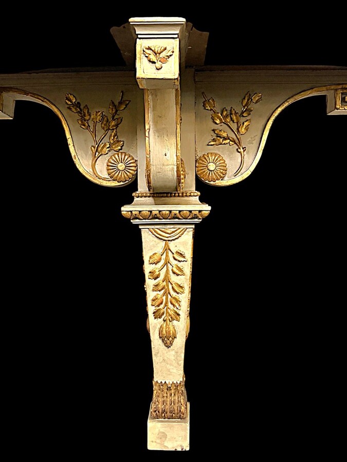 Large Empire console table with mirror, 1800–1820 (282.5 cm) Large console table with an original Empire-period mirror The console table and mirror are made of painted wood, adorned with caryatids, gilded woodwork and decorative elements.