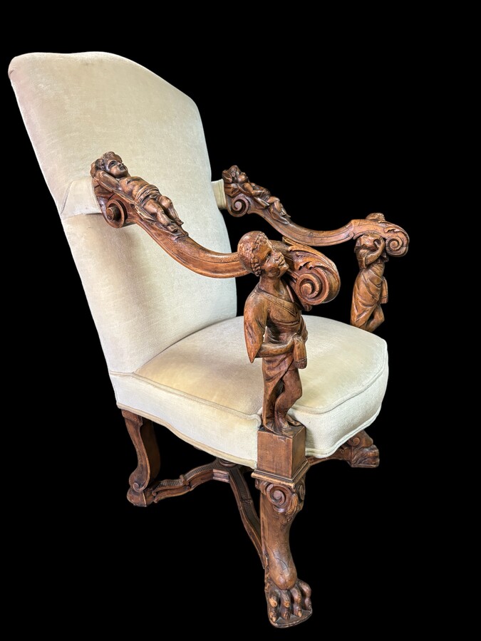 Large Italian armchair in walnut 19thC. Very decorative armchair with finely sculpted people and putti in walnut. Woodwork in good condition , fabric in used condition. Dimensions : Height : 121 cm Width : 86 cm Depth : 78 cm Italy , around 1860-1870